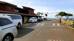 Picture of Taxi Vans waiting outside the West Maui Kapalua Airport terminal building on the island of Maui, Hawaii.